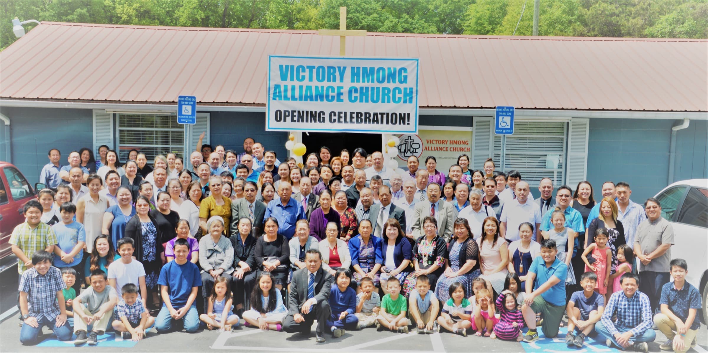 Victory Hmong Alliance Church celebrating together outside the church